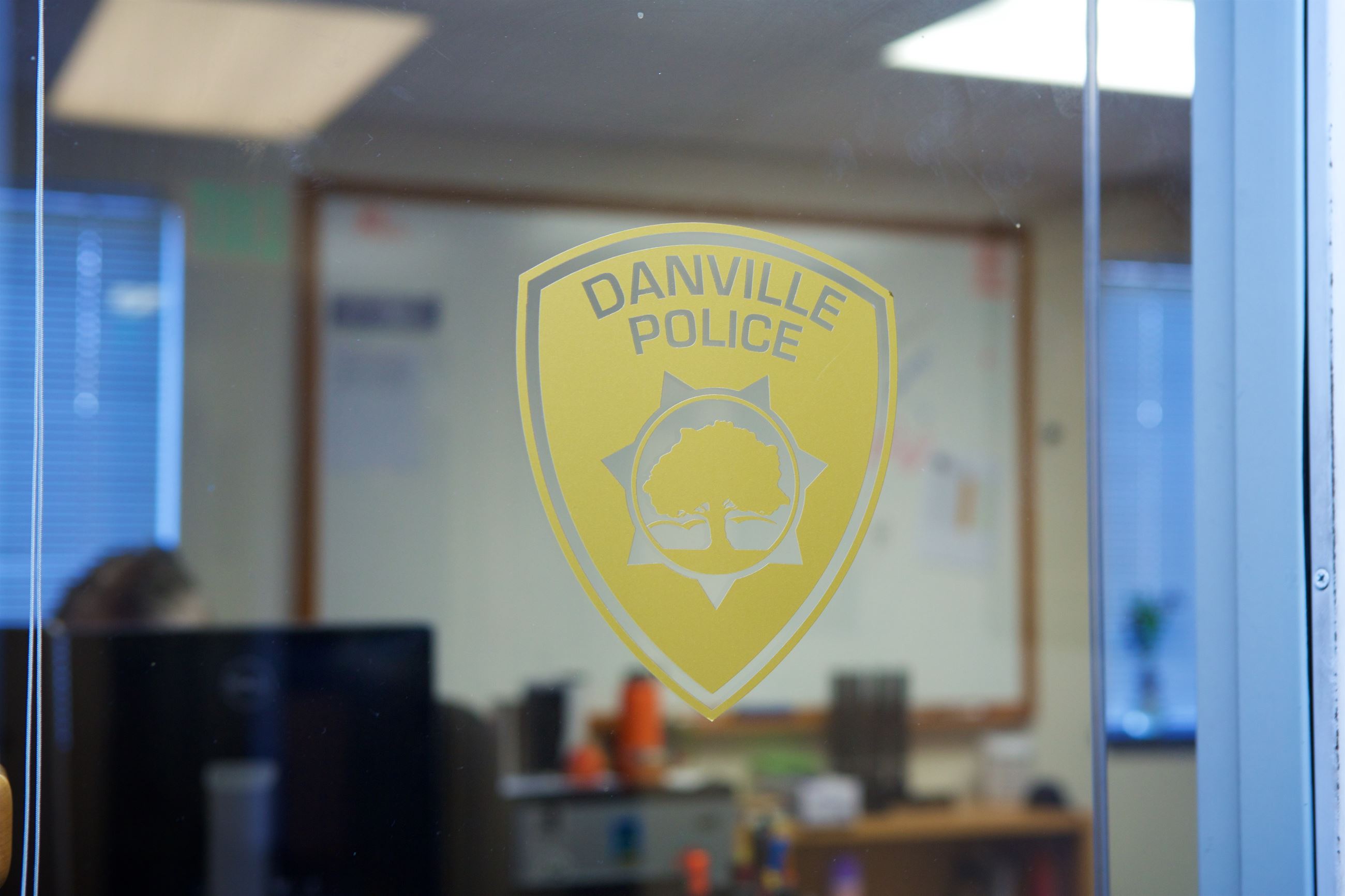 Danville Police Logo Sticker in a Window