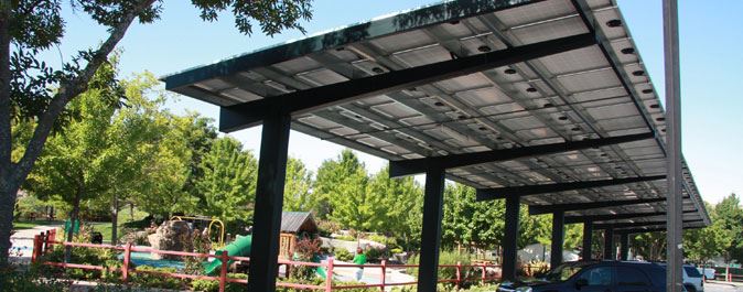 Solar Panel awning with vehicles parked underneath